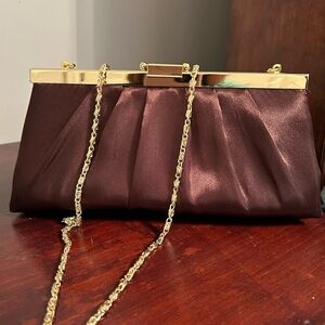Brown silk clutch with gold tone shoulder strap